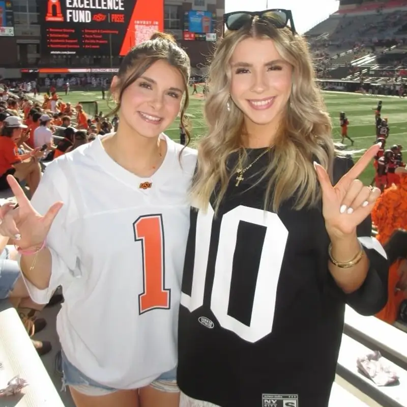 two young women at a football game