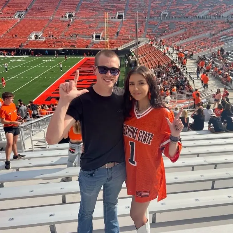 two young adults at a football game